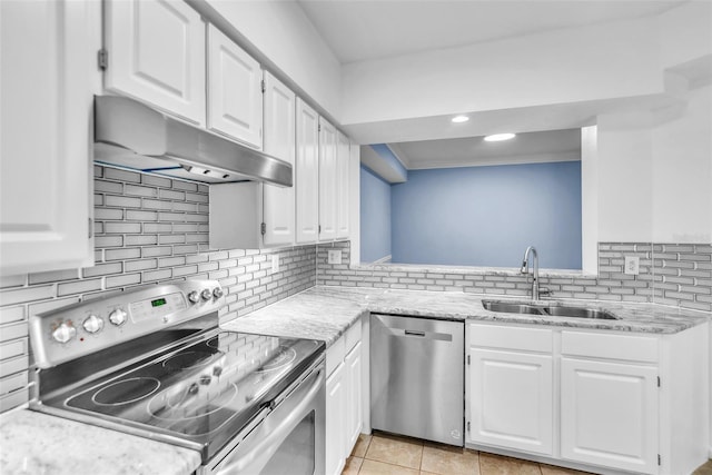 kitchen featuring white cabinetry, stainless steel appliances, under cabinet range hood, and a sink