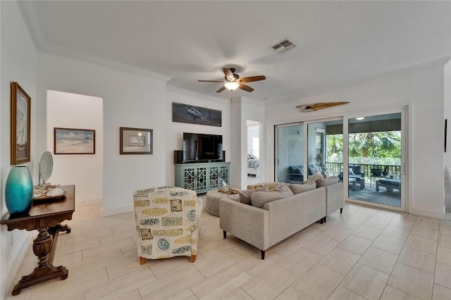 living room featuring visible vents, crown molding, baseboards, and ceiling fan
