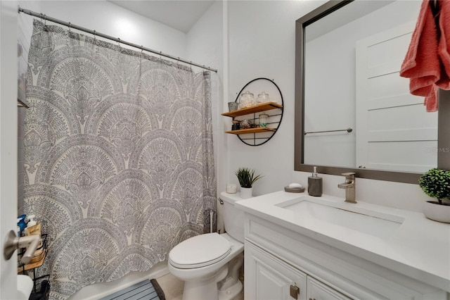 bathroom with vanity, toilet, and a shower with curtain