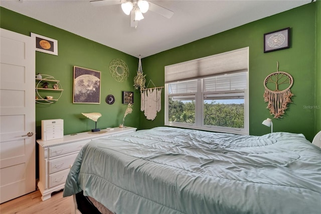 bedroom featuring light wood-style flooring and ceiling fan