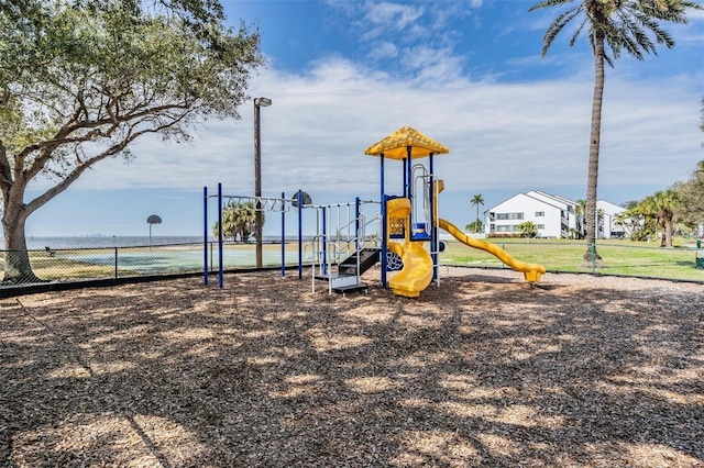 communal playground featuring fence