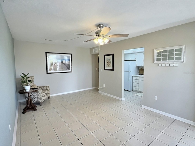 1001 77th Ave N Unit 206, Saint Petersburg, FL 33702 - unfurnished room featuring light tile patterned floors, a ceiling fan, and baseboards