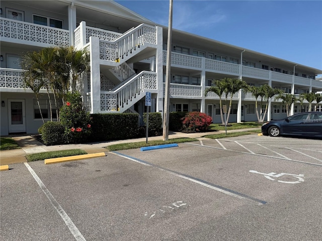 1001 77th Ave N Unit 206, Saint Petersburg, FL 33702 - uncovered parking lot featuring stairs