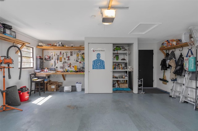 garage featuring a garage door opener and a workshop area