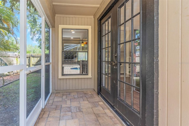 unfurnished sunroom featuring french doors