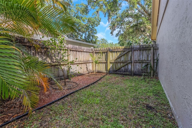 view of yard featuring a gate and fence