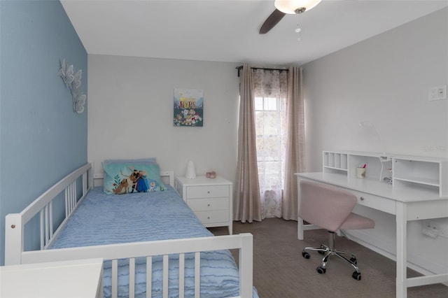 bedroom featuring a ceiling fan and carpet