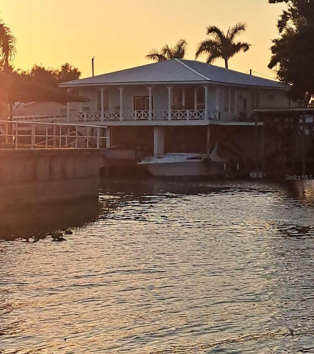 rear view of house with a water view