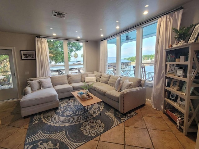 tiled living room featuring recessed lighting and visible vents