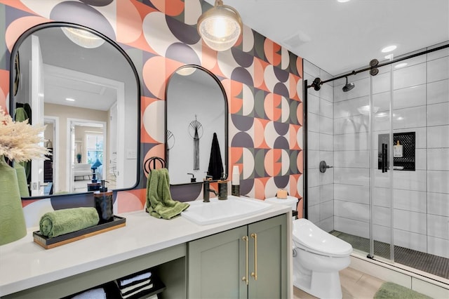 bathroom featuring toilet, a stall shower, tile patterned floors, and vanity