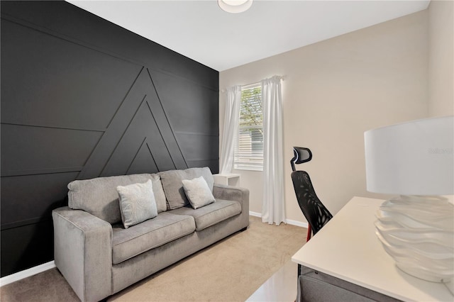 home office featuring baseboards and light colored carpet