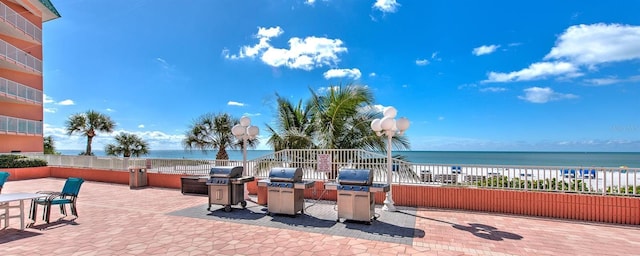 18400 Gulf Blvd Unit 1109, Indian Shores, FL 33785 - view of patio / terrace with area for grilling and a water view