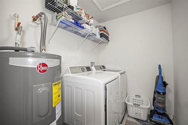 laundry area with water heater, laundry area, and independent washer and dryer