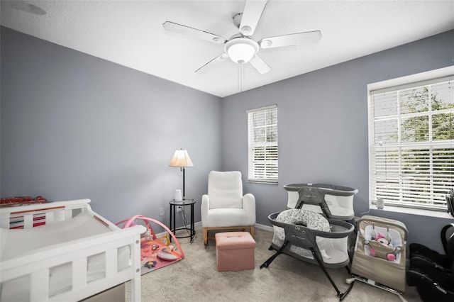 bedroom with ceiling fan and carpet