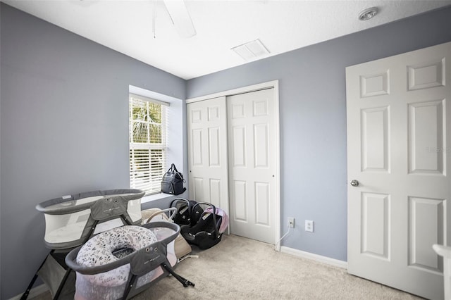 interior space featuring carpet flooring and baseboards