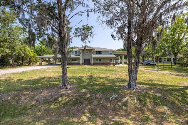 592 Ken Hubbard Rd, Terra Ceia, FL 34250 - view of front of home featuring driveway, a carport, and stucco siding