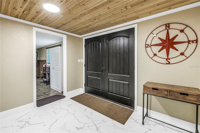 592 Ken Hubbard Rd, Terra Ceia, FL 34250 - entrance foyer featuring marble finish flooring, baseboards, ornamental molding, and wood ceiling