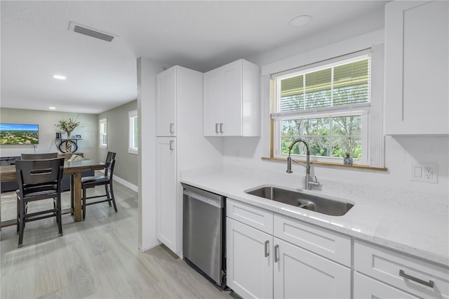 592 Ken Hubbard Rd, Terra Ceia, FL 34250 - kitchen featuring dishwasher, a sink, white cabinetry, light stone counters, and recessed lighting