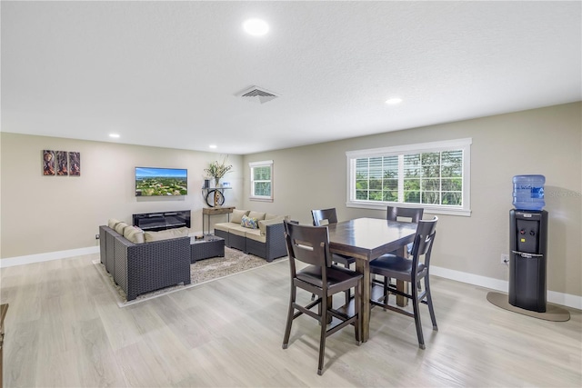 592 Ken Hubbard Rd, Terra Ceia, FL 34250 - dining space with light wood-type flooring, recessed lighting, healthy amount of natural light, and baseboards