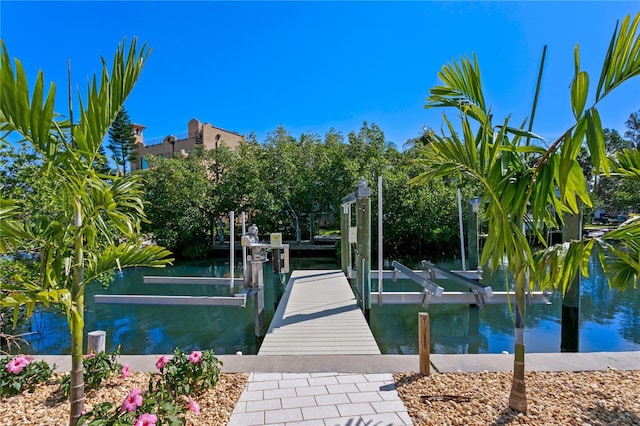 view of dock with boat lift and a water view