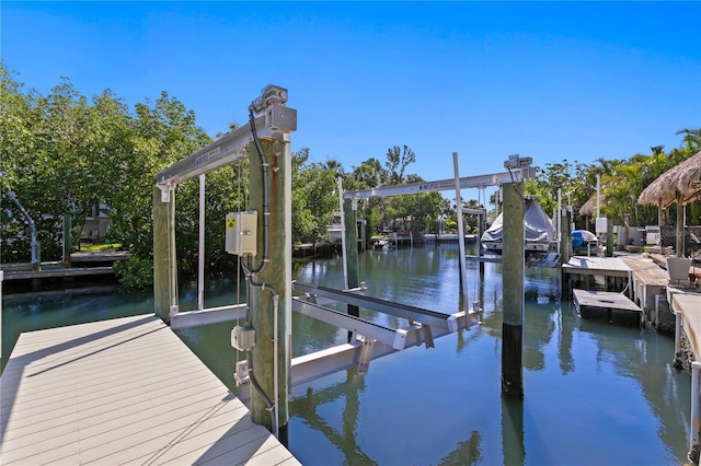 dock area featuring a water view and boat lift