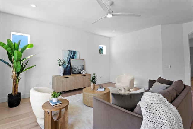 living area featuring recessed lighting, ceiling fan, baseboards, and light wood-type flooring