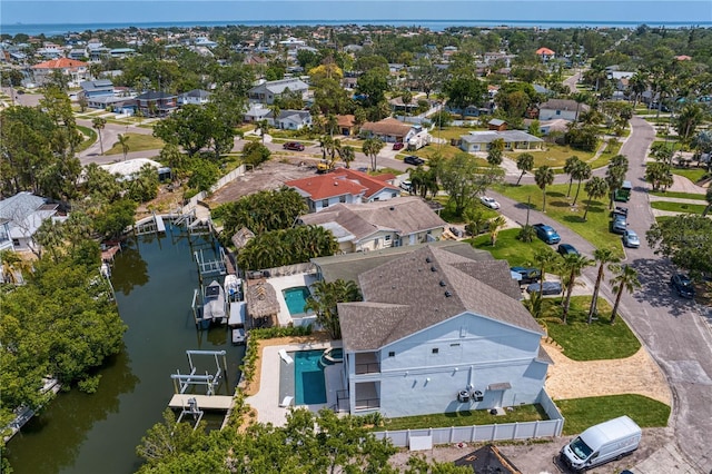 bird's eye view featuring a water view and a residential view