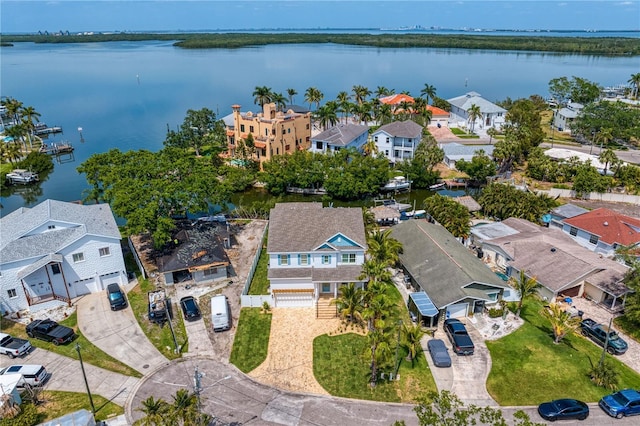 birds eye view of property featuring a water view and a residential view