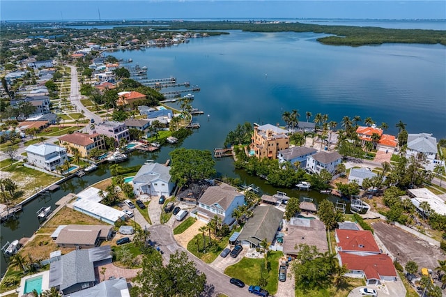 birds eye view of property featuring a water view and a residential view