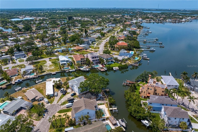 drone / aerial view featuring a residential view and a water view