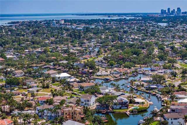 drone / aerial view featuring a residential view and a water view