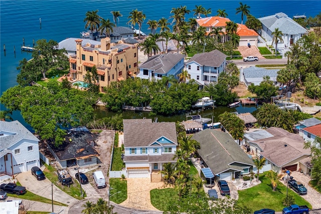 birds eye view of property featuring a water view and a residential view