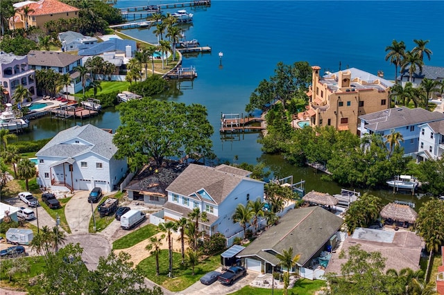 birds eye view of property with a residential view and a water view