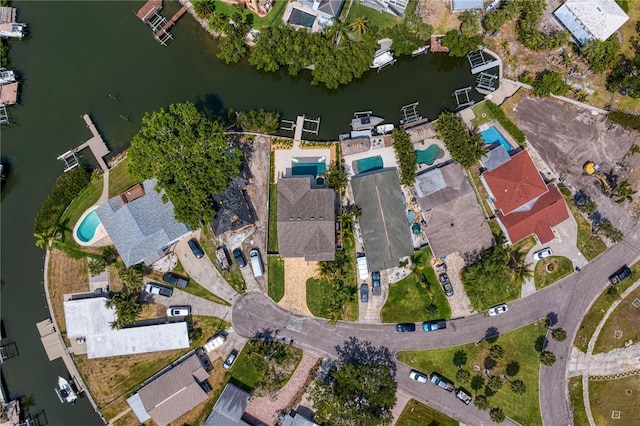birds eye view of property with a water view