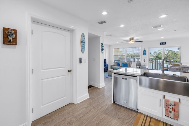100 Windrush Blvd Unit 1, Indian Rocks Beach, FL 33785 - kitchen featuring stainless steel dishwasher, a sink, recessed lighting, white cabinets, and ceiling fan