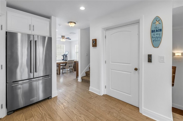 100 Windrush Blvd Unit 1, Indian Rocks Beach, FL 33785 - kitchen with high end refrigerator, baseboards, white cabinetry, light wood-type flooring, and recessed lighting