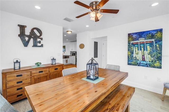 100 Windrush Blvd Unit 1, Indian Rocks Beach, FL 33785 - dining area featuring ceiling fan, baseboards, light wood-style flooring, recessed lighting, and electric panel