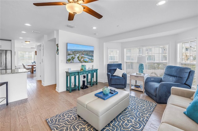 100 Windrush Blvd Unit 1, Indian Rocks Beach, FL 33785 - living area featuring a ceiling fan, recessed lighting, light wood-style flooring, and baseboards