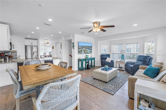 100 Windrush Blvd Unit 1, Indian Rocks Beach, FL 33785 - living room featuring ceiling fan, recessed lighting, light wood-type flooring, and baseboards