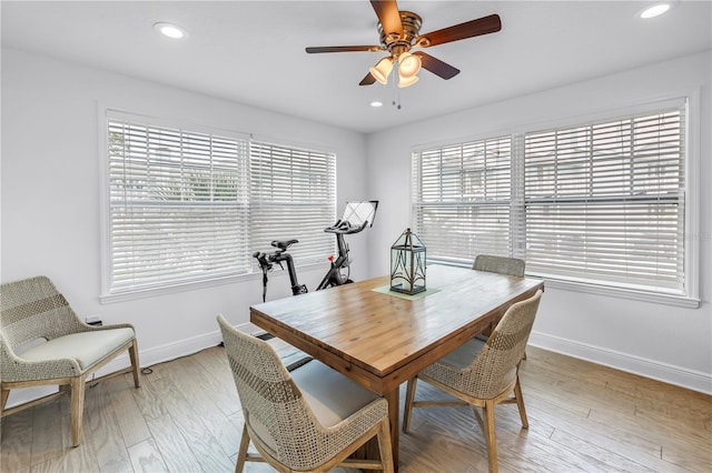 100 Windrush Blvd Unit 1, Indian Rocks Beach, FL 33785 - dining space with baseboards, healthy amount of natural light, a ceiling fan, recessed lighting, and light wood-style floors
