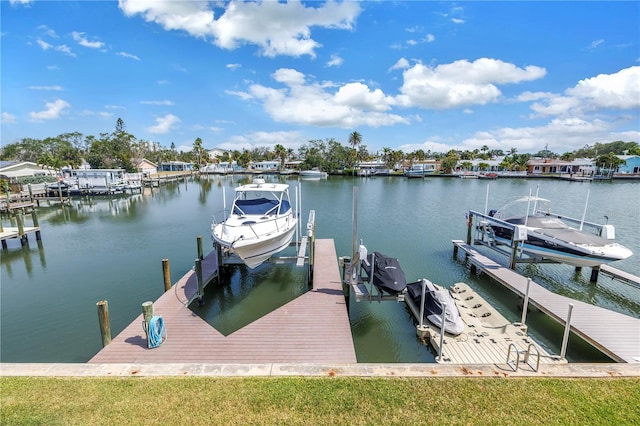 100 Windrush Blvd Unit 1, Indian Rocks Beach, FL 33785 - dock with boat lift and a water view