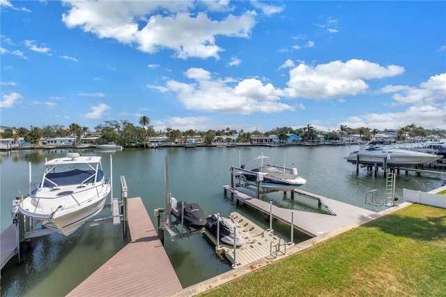 100 Windrush Blvd Unit 1, Indian Rocks Beach, FL 33785 - dock with boat lift, a water view, and a lawn