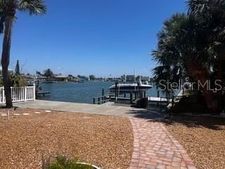 dock area featuring a water view and boat lift