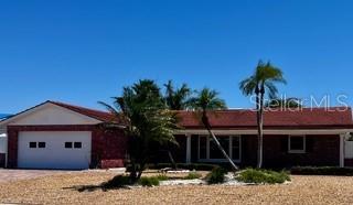 single story home with an attached garage and driveway