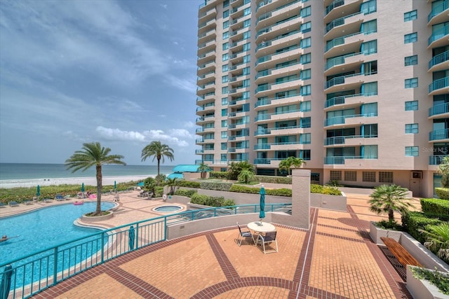 view of pool with a water view