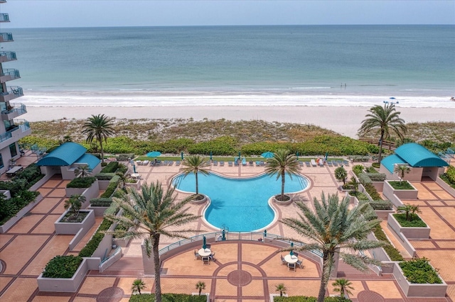 community pool featuring a water view and a view of the beach
