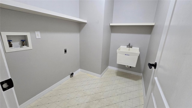 clothes washing area featuring laundry area, electric dryer hookup, a sink, hookup for a washing machine, and light floors