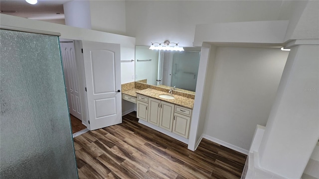 full bath with vanity and wood finished floors