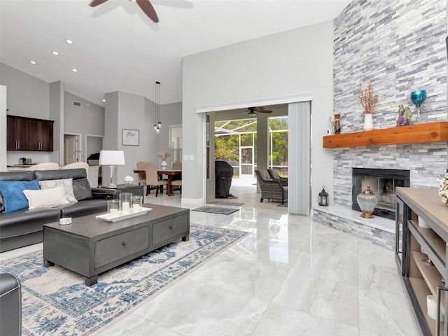 living area featuring marble finish floor, ceiling fan, high vaulted ceiling, and visible vents