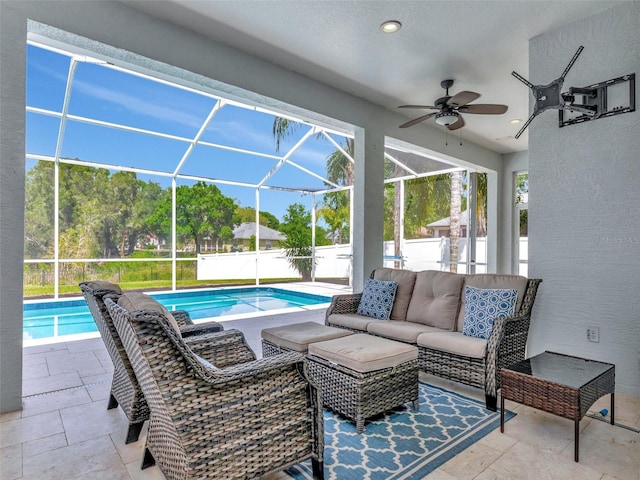 view of patio / terrace featuring a fenced in pool, glass enclosure, fence, a ceiling fan, and an outdoor living space